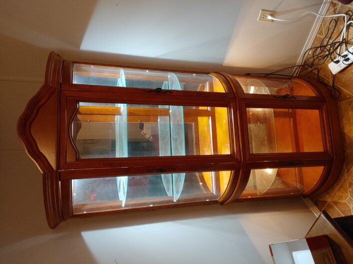 Beautiful lit Corner curio cabinet for sale