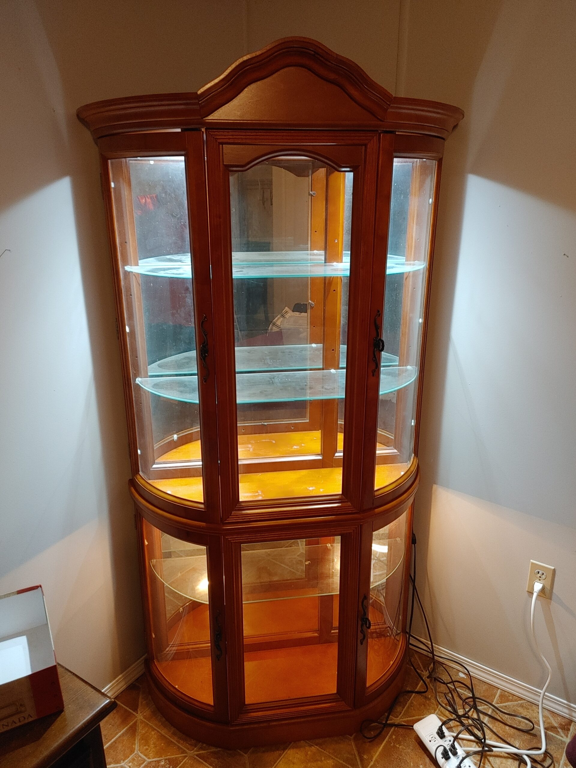 Beautiful lit Corner curio cabinet for sale